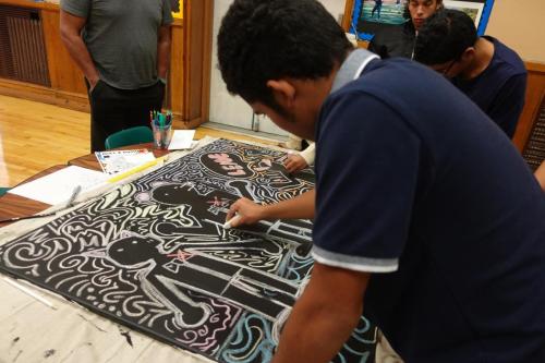 Members painting their murals