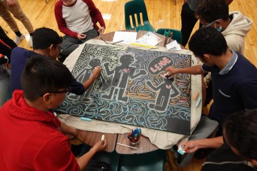 Members painting their murals